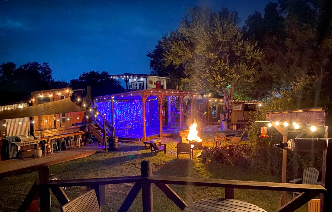 Stage lit up at night with a fire